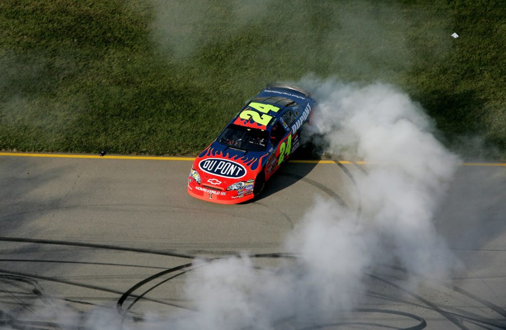 Jeff Gordon 24 Du Pont race car NASCAR high angle smoke celebration